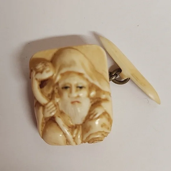 Vintage cream intricate bearded man holding staff cufflinks.Rare find. Unique.
